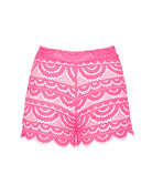 Pink lace shorts against a white wall.