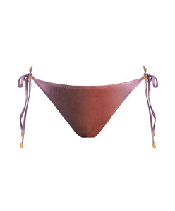 A purple bikini bottom against a white wall. 