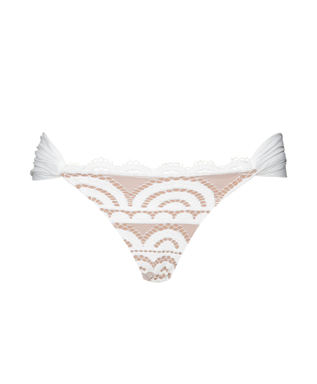 A white lace bikini bottom against a white wall.