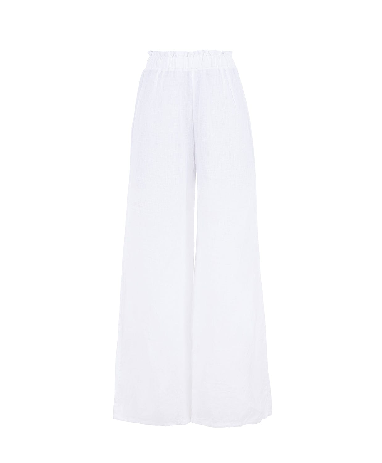 Long white linen pants against a white wall.