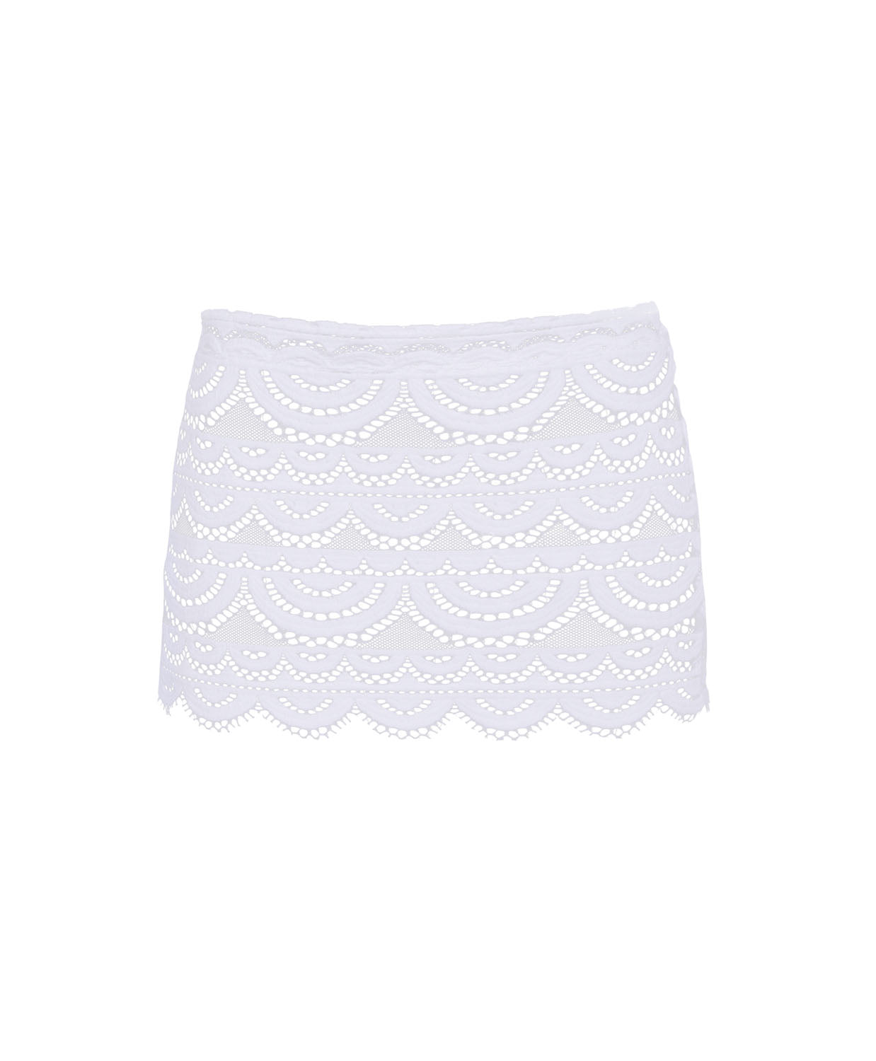 A white lace mini skirt with a scalloped hem against a white wall.