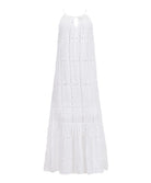 A long white dress against a white wall. 