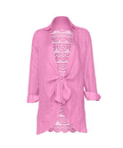 Pink lace-trimmed cover up on a white background