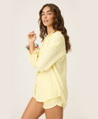 Yellow Stripe Gauze Short in sunny yellow and white pinstripes, featuring soft fabric and playful pink tassel ties, styled for casual summer wear or lounging.