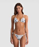American Beauty Reversible Triangle Top bikini with royal blue stripes on one side and fresh floral print on the other, lace-trim embroidered string silhouette.