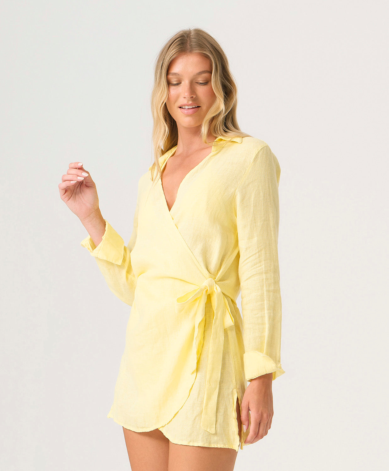 Buttercup Lily Cover Up in pastel yellow linen with classic collar, tailored sleeves, and adjustable side tie.
