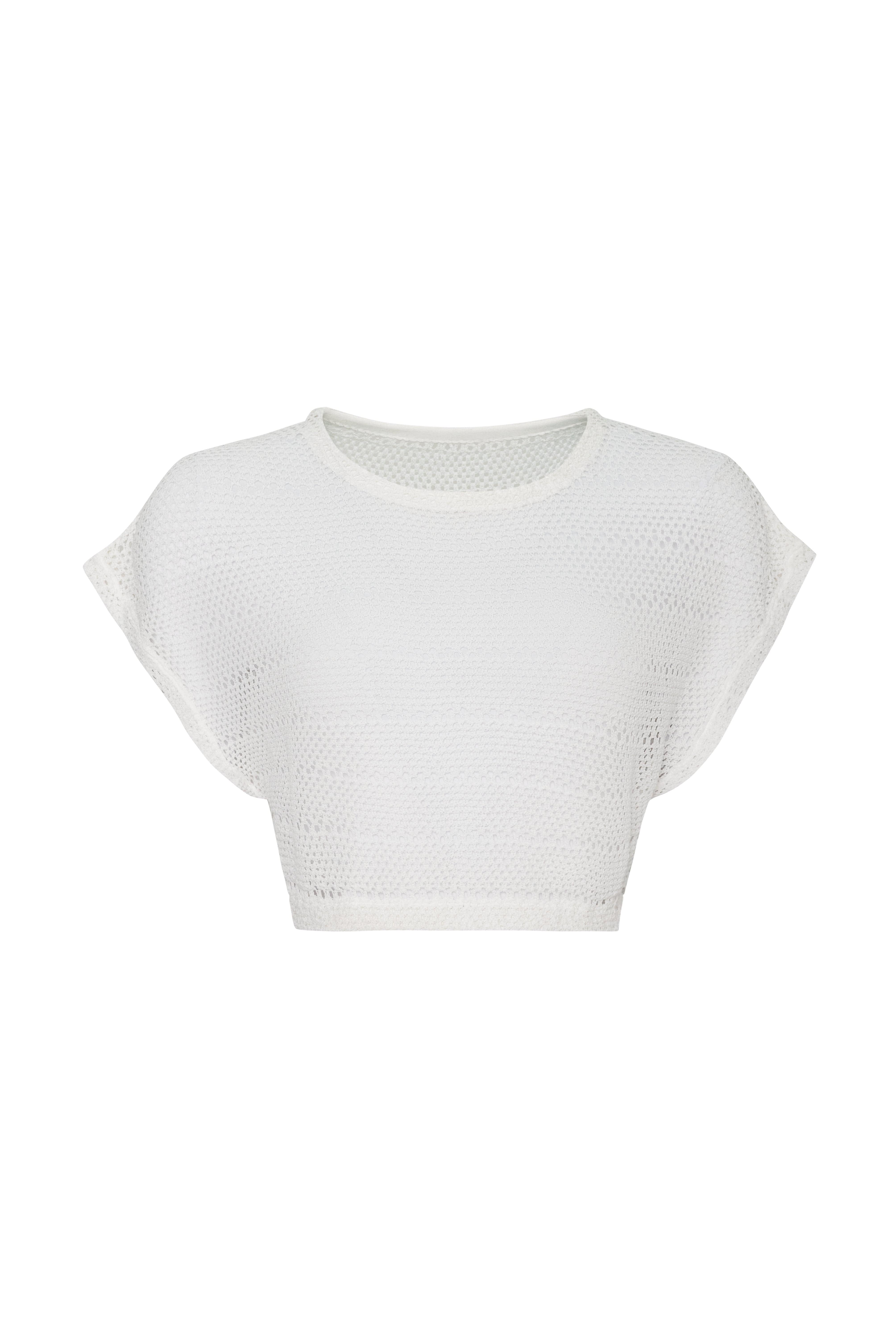 Cream knit crop top in front of a white background. 