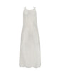 An ivory sleeveless cover up with scalloped lace detailing. Featured against a white wall background.