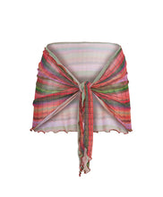 A multi-colored stripe print sarong. Featured against a white wall background.