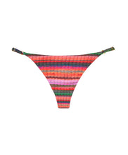 A multi-colored stripe print adjustable bikini bottom with gold details. Featured against a white wall background.