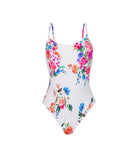 Model wearing the Smocked Elodie One Piece swimsuit in a vibrant floral print