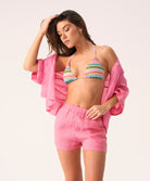 Hot pink linen shorts with a relaxed fit and flattering silhouette, designed for comfort and warm-weather style.