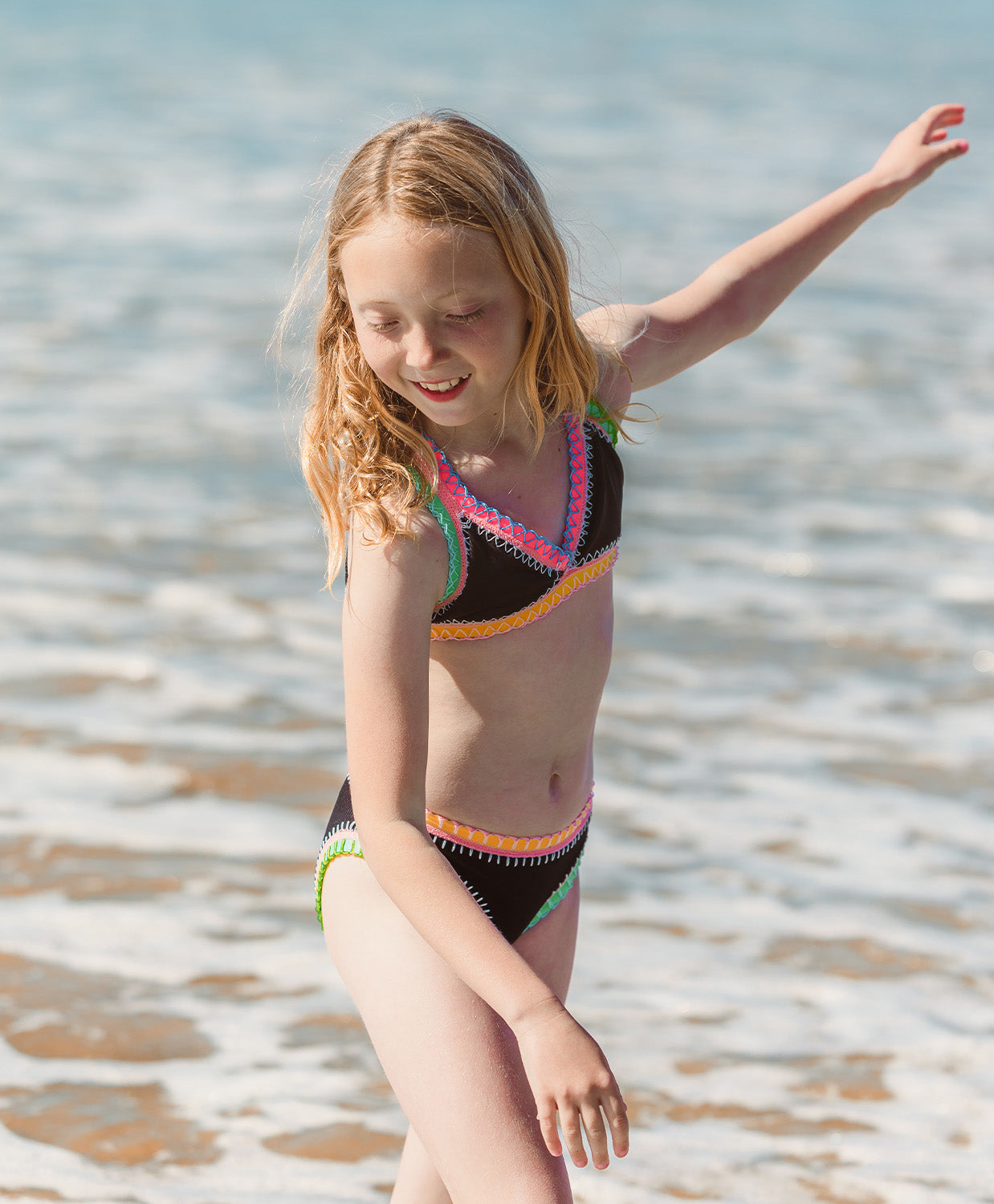 Kids Black Pearl Rainbow Embroidered Bikini with colorful exposed elastic detailing.