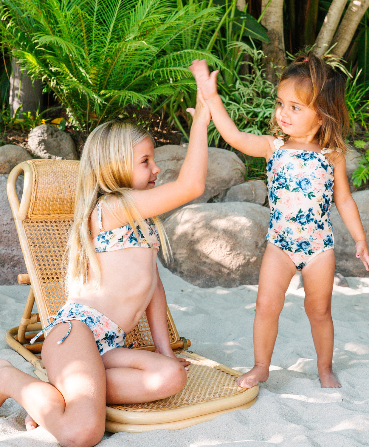 Kids Blossom Winnie Flower One Piece swimsuit with playful floral print and crochet flower straps for sunny adventures.