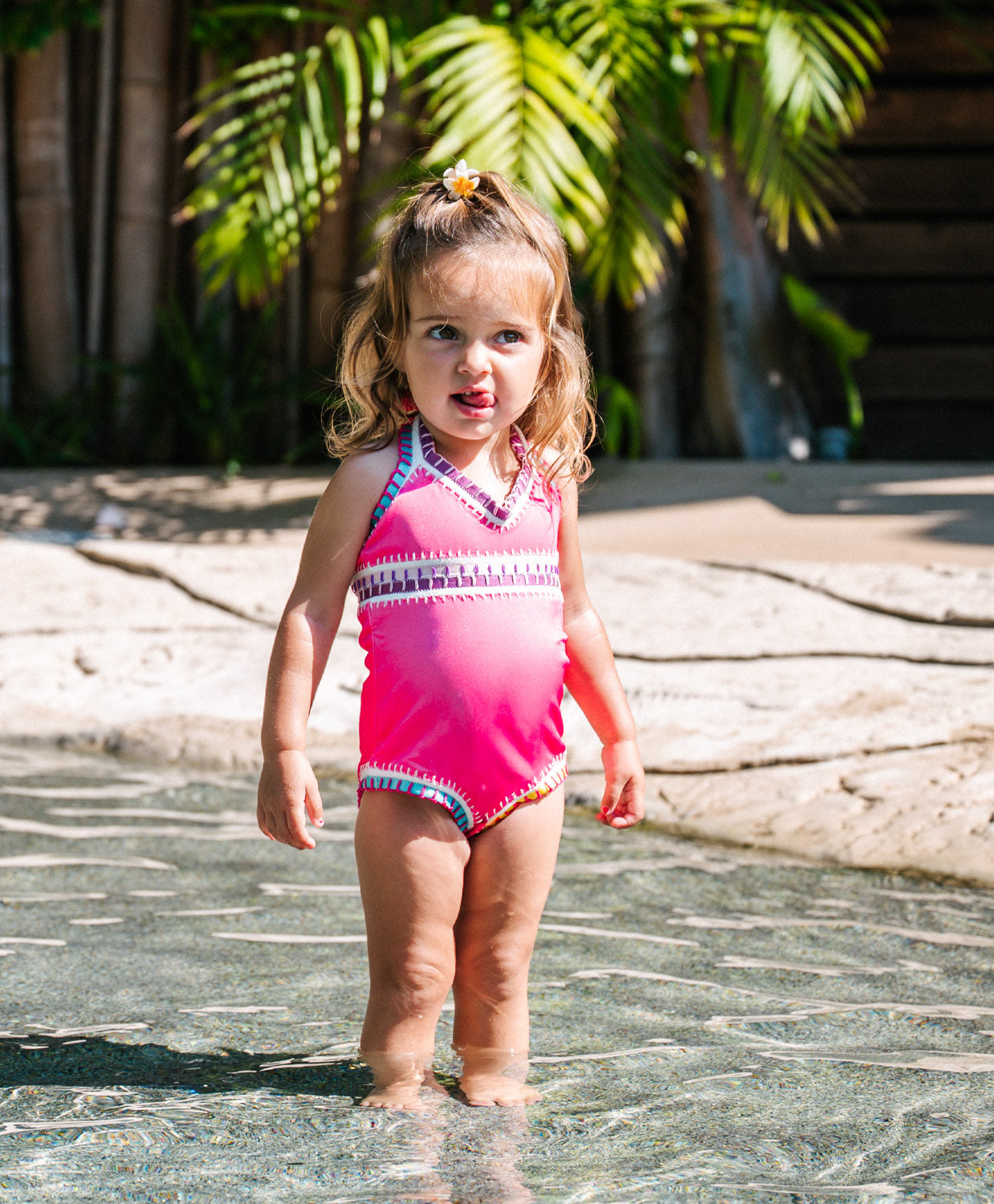 Kids Bright Pink Sadie Rainbow Embroidered One Piece swimsuit with multicolor elastic embroidery and soft tie-dye design.