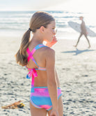 Kids Dreamy Rainbow Embroidered Bikini featuring colorful tie-dye design and exposed elastic detailing inspired by Solange Ferrarini.