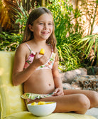 Kids Paradise Bloom Elsie Ruffle Bikini with tropical floral print and playful yellow ruffle details for sunny beach days.