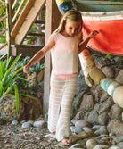 Kids White Chloe Set crochet outfit with pink accents and adjustable drawstring pants, perfect for sunny day adventures.