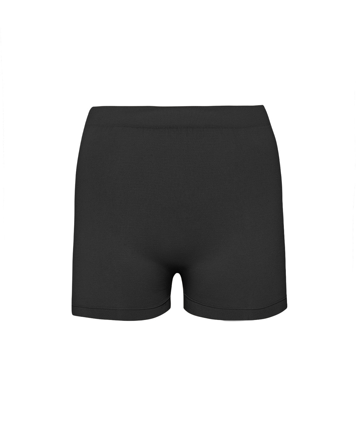 A woman wearing a black luxe layers midnight shorts standing against a white wall.