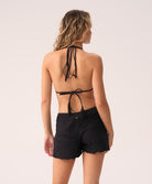 Midnight Adele Short—relaxed, ruffled resort shorts with adjustable tie waist and 24k gold-plated accents.