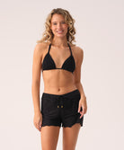 Midnight Adele Short—relaxed, ruffled resort shorts with adjustable tie waist and 24k gold-plated accents.