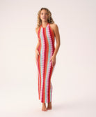 Floor-length multicolor crochet dress with a low back and halter neck ties, called the Milos Aurelia Dress.