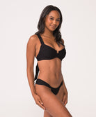 woman wearing a black texture underwire bikini and fanned bottom.