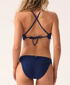 Blue lace halter bikini top featuring hand-cut lace detailing, supportive halter straps
