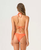 Paloma Lettuce Edge Triangle Top in vibrant orange textured fabric with pink ripple trim and hand-crocheted accents