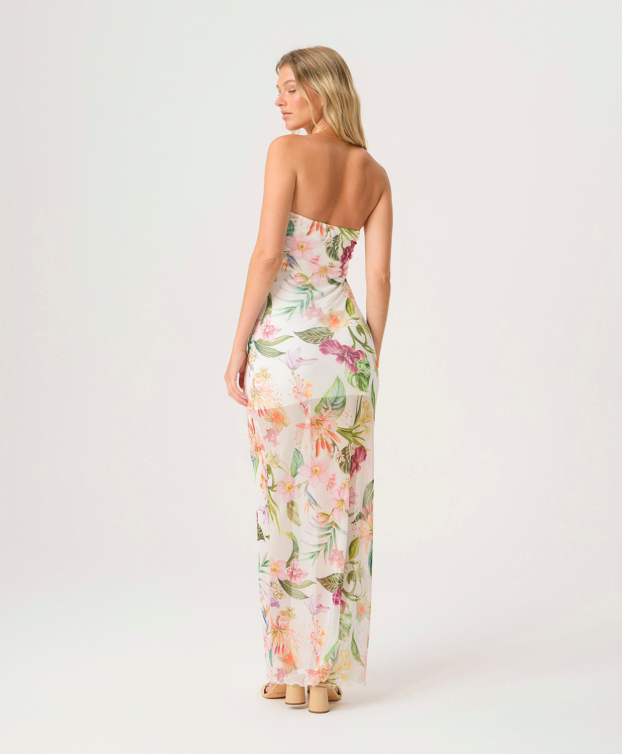 Paradise Bloom Sofia Tube Dress strapless floor-length dress with tropical floral print, sheer hem, and subtle back slit.