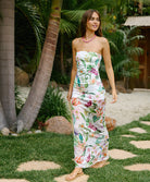 Paradise Bloom Sofia Tube Dress strapless floor-length dress with tropical floral print, sheer hem, and subtle back slit.