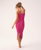 Petunia Poppy Dress in soft ribbed knit, fitted silhouette with subtle back slit, shown in pink.
