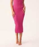 Petunia Poppy Dress in soft ribbed knit, fitted silhouette with subtle back slit, shown in pink.