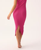 Petunia Poppy Dress in soft ribbed knit, fitted silhouette with subtle back slit, shown in pink.