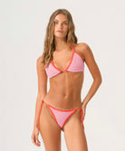 Rosé Tia Crochet Tie Side Bottom with soft pink crochet, red color-blocked trim, adjustable side ties, and a flattering low-rise fit.