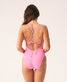 Pink, red, and white chevron Scarlet Margot One Piece swimsuit with crisscross straps and gold details.