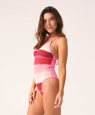 Pink, red, and white chevron Scarlet Margot One Piece swimsuit with crisscross straps and gold details.
