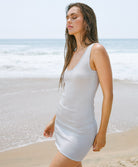 Silver James Cover Up in lightweight semi-sheer silver fabric, styled as a chic beachside or evening cover-up.