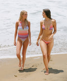 Sunkissed Remi One Piece in multicolor shimmering chevron fabric with halter tie, plunging neckline, and low back.