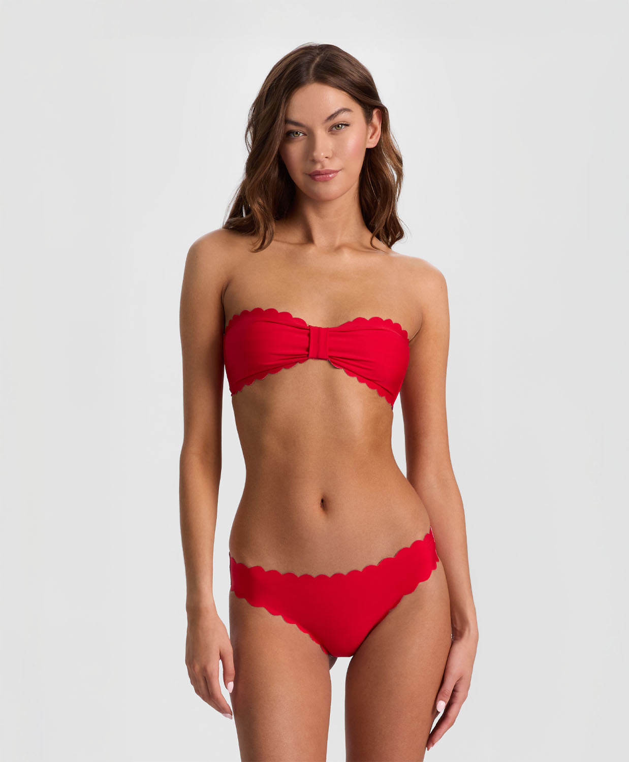 Teakwood Reversible Scalloped Bandeau strapless bikini top with scalloped trim, nautical stripes on one side and sea siren red on the reverse