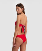 Teakwood Reversible Scalloped Bandeau strapless bikini top with scalloped trim, nautical stripes on one side and sea siren red on the reverse