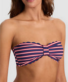 Teakwood Reversible Scalloped Bandeau strapless bikini top with scalloped trim, nautical stripes on one side and sea siren red on the reverse