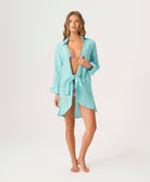 Water Millie Tie Cover Up in bright blue linen with tie closure, styled over swimwear