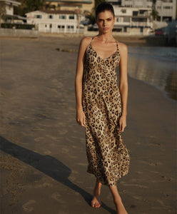 Woman Posing On The Beach in Resort Dress